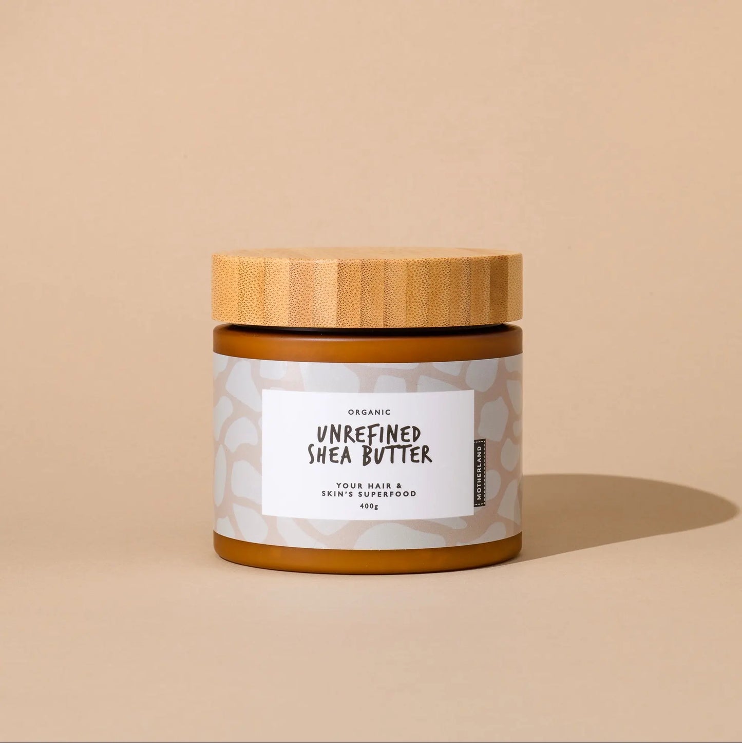 Motherland Organics 400g jar of raw, organic unrefined shea butter with a bamboo lid. Natural shea body butter and moisturiser for dry skin, face, hair, and eczema. 100% vegan, cruelty-free, and ideal for sensitive skin