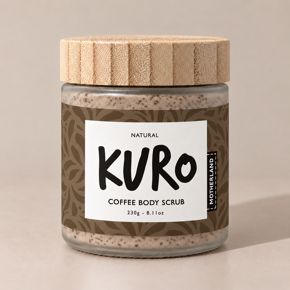 Open jar of KURO coffee body scrub showing the coffee and sugar texture