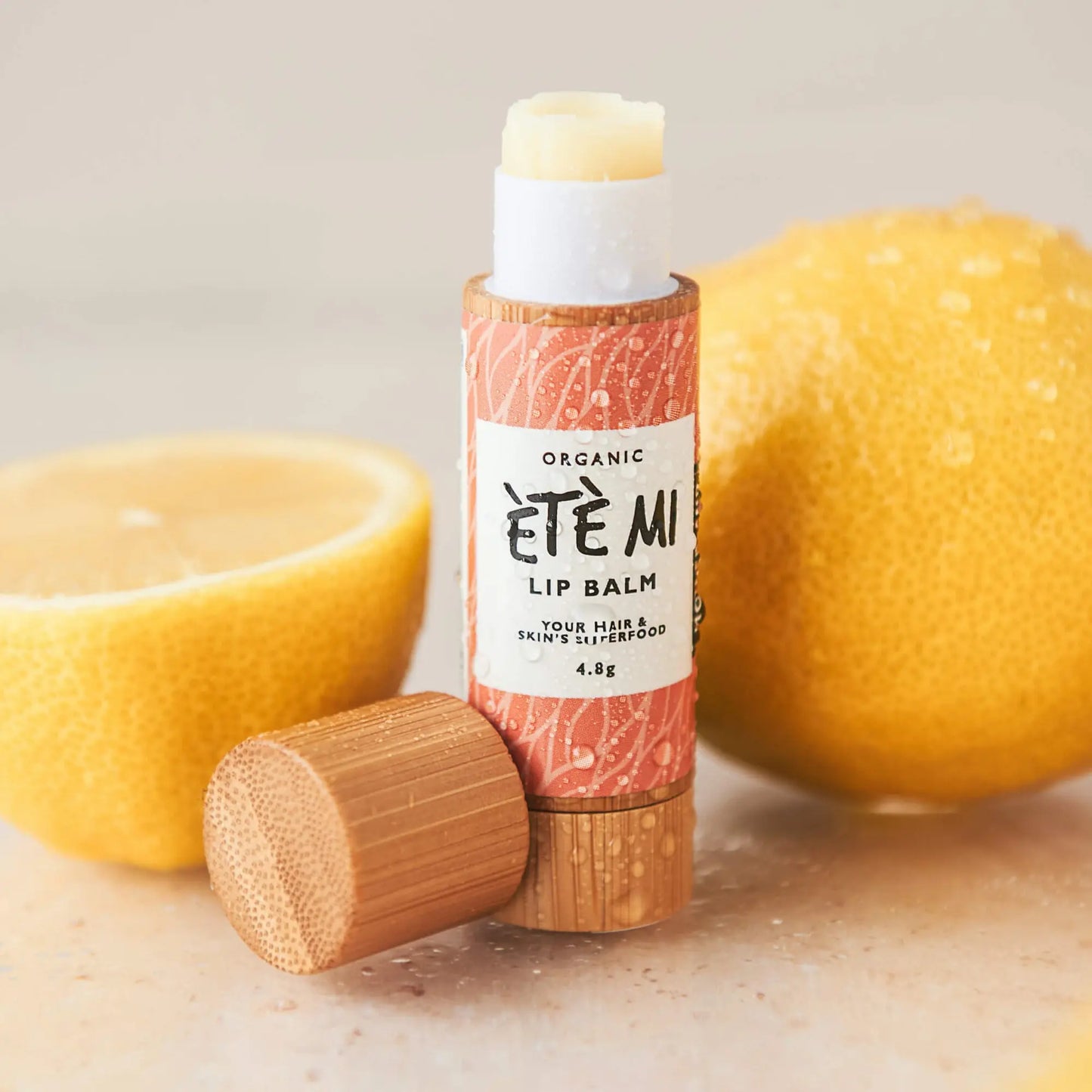 Hydrating and plumping organic lip balm for dry, chapped lips, in a sustainable bamboo tube, infused with shea butter and citrus for soft, nourished, fuller-looking lips.